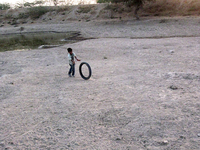 boy with tyre in Rajasthan